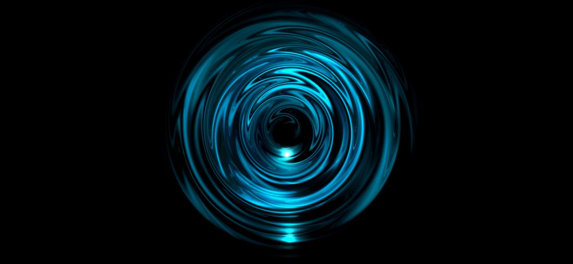 Abstract glowing blue vortex with light ring on black background